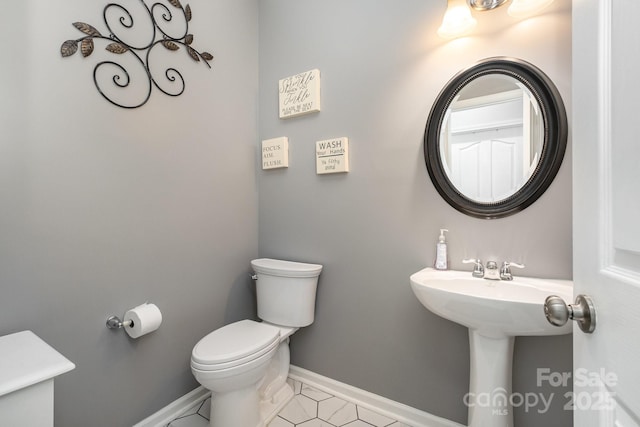 217 Fielding St, Mount Holly, NC 28120 - half bath featuring toilet and tile patterned floors