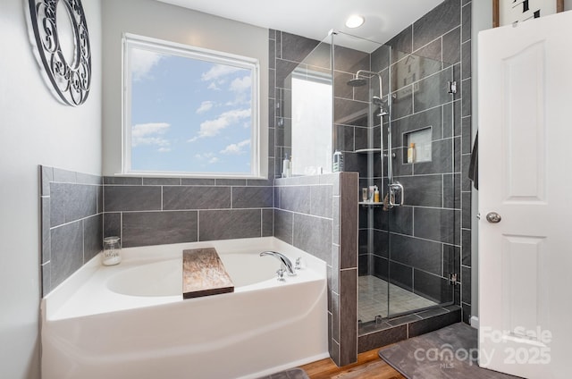 217 Fielding St, Mount Holly, NC 28120 - full bathroom with a garden tub, a stall shower, wood finished floors, and recessed lighting