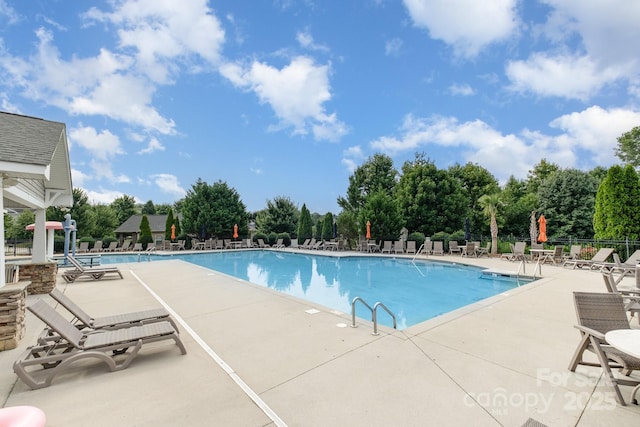 217 Fielding St, Mount Holly, NC 28120 - community pool featuring a patio and view of scattered trees