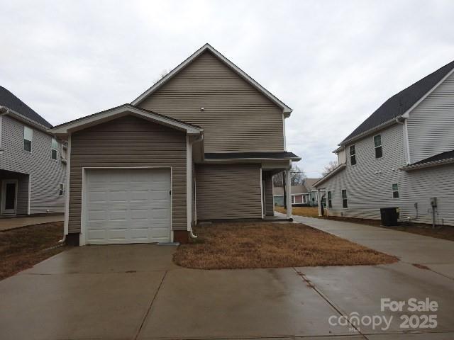 252 Mills Ave, Troutman, NC 28166 - view of front of property with driveway and a garage