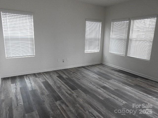 252 Mills Ave, Troutman, NC 28166 - spare room with dark wood-type flooring and plenty of natural light