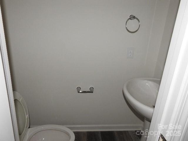 252 Mills Ave, Troutman, NC 28166 - bathroom featuring toilet and wood finished floors