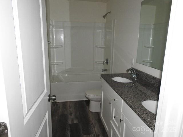 252 Mills Ave, Troutman, NC 28166 - full bath featuring double vanity, wood finished floors, and shower / washtub combination