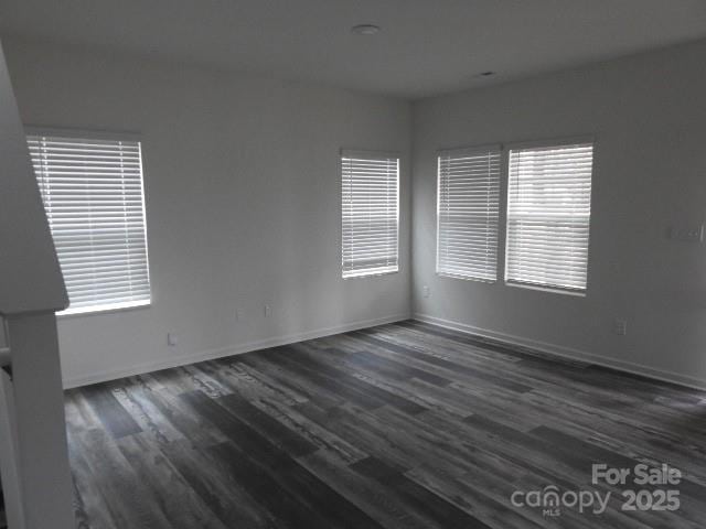 260 Mills Ave, Troutman, NC 28166 - unfurnished room with dark wood-style floors and baseboards