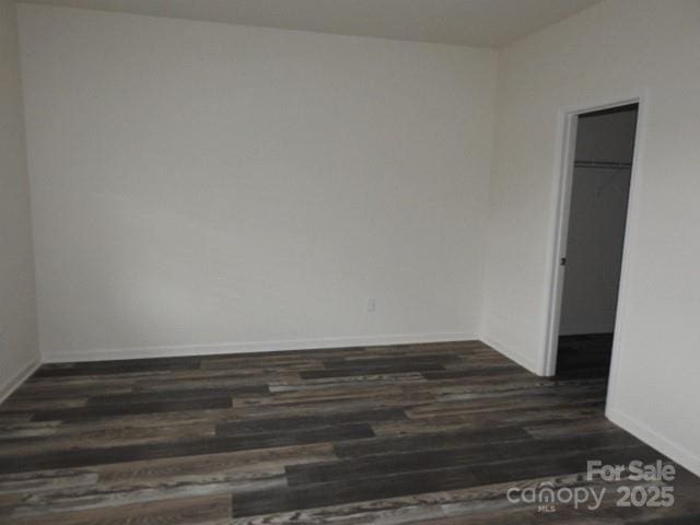260 Mills Ave, Troutman, NC 28166 - empty room with dark wood-style flooring and baseboards