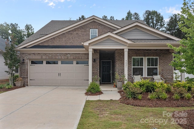 9021 Myrna Dr, Gastonia, NC 28056 - view of front of house with brick siding, covered porch, and an attached garage
