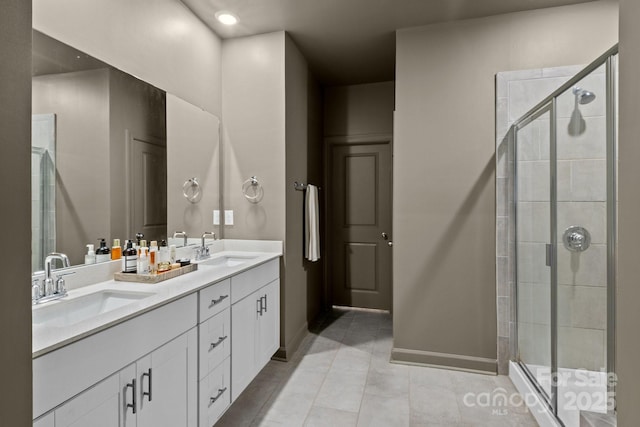 9021 Myrna Dr, Gastonia, NC 28056 - bathroom featuring double vanity, a stall shower, and tile patterned flooring