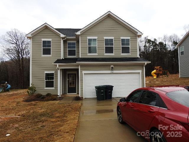 212 Sugar Hill Rd, Troutman, NC 28166 - traditional home with a garage and driveway