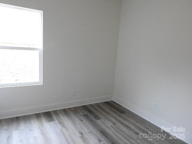 212 Sugar Hill Rd, Troutman, NC 28166 - empty room with wood finished floors and baseboards