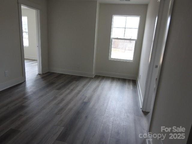 212 Sugar Hill Rd, Troutman, NC 28166 - unfurnished room with dark wood-type flooring and plenty of natural light