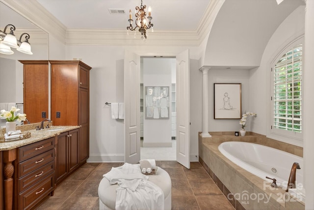 1505 Hawkstone Dr, Waxhaw, NC 28173 - bathroom with a tub with jets, vanity, ornamental molding, ornate columns, and a chandelier