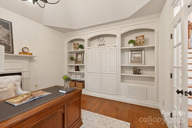 1505 Hawkstone Dr, Waxhaw, NC 28173 - office area with wood finished floors, lofted ceiling, a fireplace, and built in features