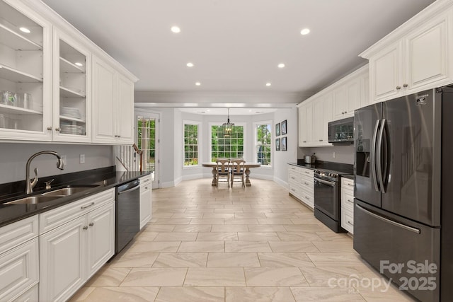 1505 Hawkstone Dr, Waxhaw, NC 28173 - kitchen with appliances with stainless steel finishes, white cabinetry, recessed lighting, dark countertops, and glass insert cabinets