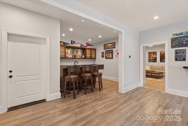 1505 Hawkstone Dr, Waxhaw, NC 28173 - indoor wet bar with light wood-style flooring and recessed lighting