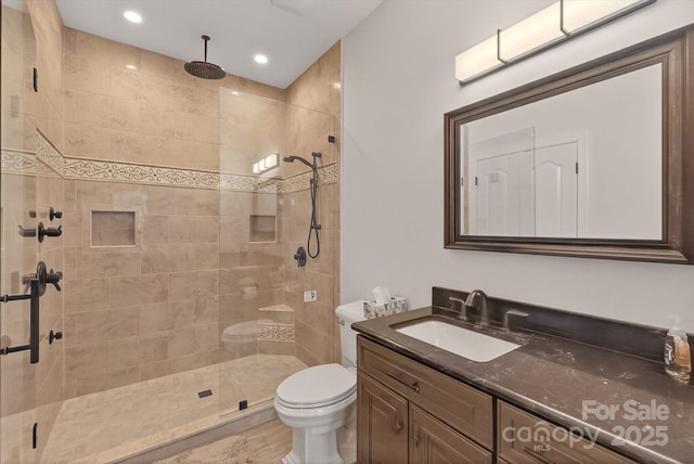 1505 Hawkstone Dr, Waxhaw, NC 28173 - bathroom featuring vanity, tiled shower, recessed lighting, and wood finished floors