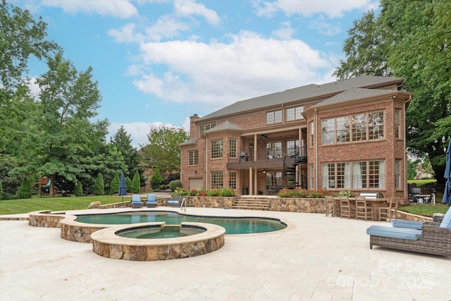 1505 Hawkstone Dr, Waxhaw, NC 28173 - view of swimming pool with a patio, a pool with connected hot tub, and stairs