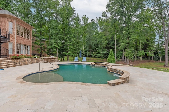 1505 Hawkstone Dr, Waxhaw, NC 28173 - view of pool with a patio, stairs, a pool with connected hot tub, and view of wooded area