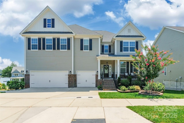 208 Canoe Pole Ln, Mooresville, NC 28117 - craftsman-style home with an attached garage, brick siding, driveway, a porch, and board and batten siding