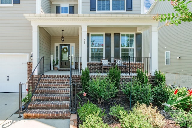 208 Canoe Pole Ln, Mooresville, NC 28117 - property entrance with covered porch and a garage