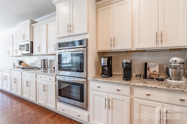 208 Canoe Pole Ln, Mooresville, NC 28117 - kitchen with appliances with stainless steel finishes, tasteful backsplash, and white cabinets