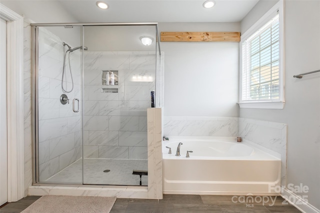 208 Canoe Pole Ln, Mooresville, NC 28117 - full bath with a bath, a shower stall, recessed lighting, and wood finished floors