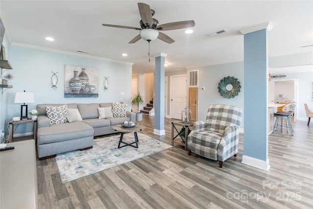 208 Canoe Pole Ln, Mooresville, NC 28117 - living room with ceiling fan, wood finished floors, stairway, crown molding, and decorative columns