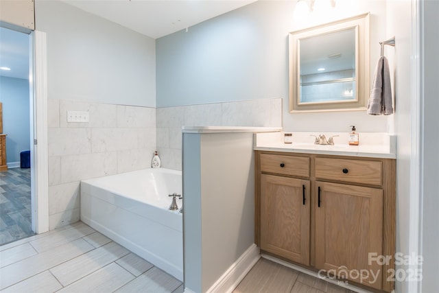 208 Canoe Pole Ln, Mooresville, NC 28117 - bathroom featuring a garden tub and vanity