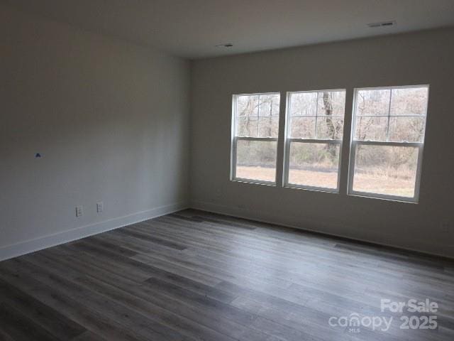 232 Sugar Hill Rd, Troutman, NC 28166 - empty room featuring healthy amount of natural light and dark wood-type flooring