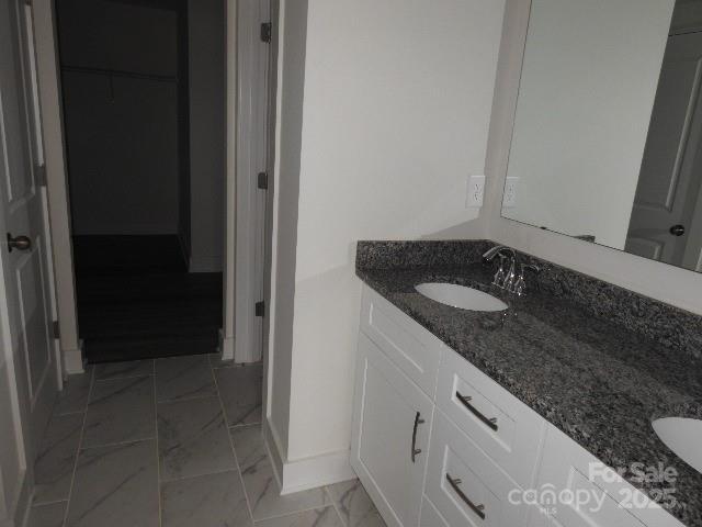 232 Sugar Hill Rd, Troutman, NC 28166 - bathroom with marble finish flooring and double vanity