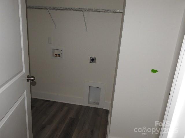 232 Sugar Hill Rd, Troutman, NC 28166 - laundry room with electric dryer hookup, dark wood-type flooring, and hookup for a washing machine