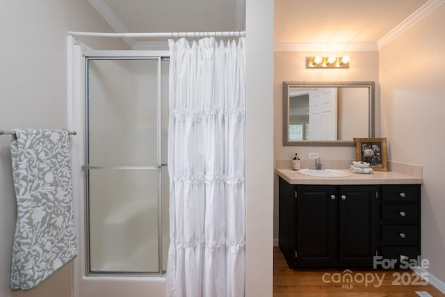 1408 Wildwood Dr, Kannapolis, NC 28081 - full bath with vanity, a shower with door, ornamental molding, and wood finished floors
