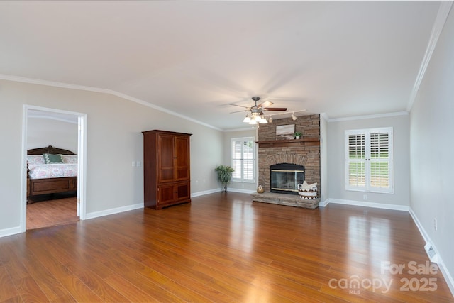 1408 Wildwood Dr, Kannapolis, NC 28081 - unfurnished living room featuring ceiling fan, wood finished floors, ornamental molding, and a fireplace
