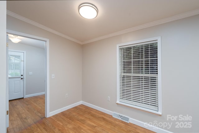 1408 Wildwood Dr, Kannapolis, NC 28081 - spare room with ornamental molding and light wood-type flooring