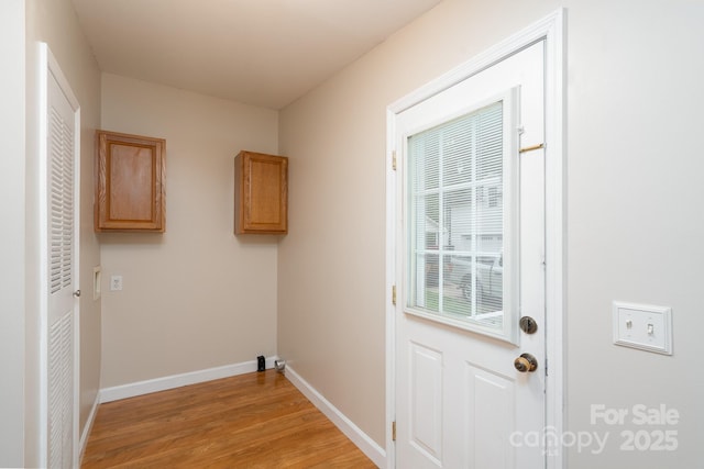 1408 Wildwood Dr, Kannapolis, NC 28081 - laundry area with light wood-style flooring and baseboards