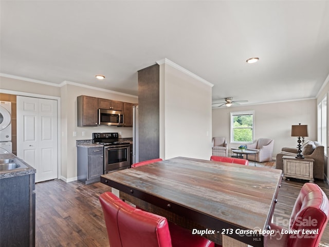 113 Bronco Way, Waynesville, NC 28785 - dining space with stacked washer / drying machine, a ceiling fan, dark wood-style flooring, crown molding, and recessed lighting