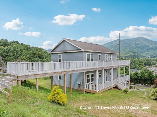 113 Bronco Way, Waynesville, NC 28785 - rear view of property with a deck with mountain view and a yard