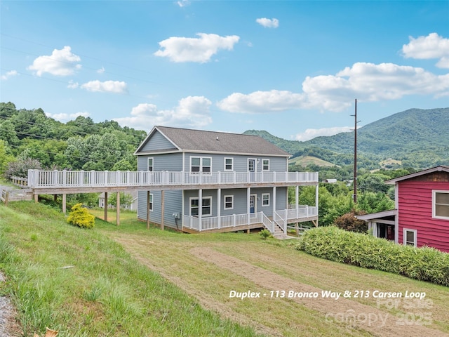 113 Bronco Way, Waynesville, NC 28785 - back of house with a yard and a deck with mountain view