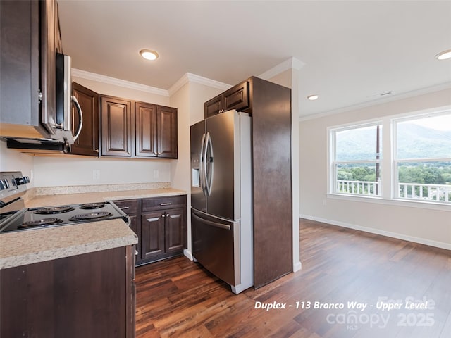 113 Bronco Way, Waynesville, NC 28785 - kitchen featuring stainless steel appliances, dark brown cabinetry, ornamental molding, dark wood finished floors, and light countertops