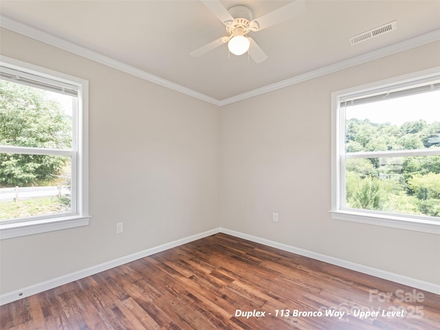 113 Bronco Way, Waynesville, NC 28785 - unfurnished room featuring healthy amount of natural light, wood finished floors, crown molding, and a ceiling fan