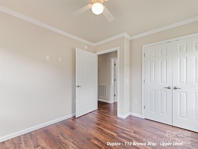 113 Bronco Way, Waynesville, NC 28785 - unfurnished bedroom with ornamental molding, wood finished floors, a closet, and a ceiling fan