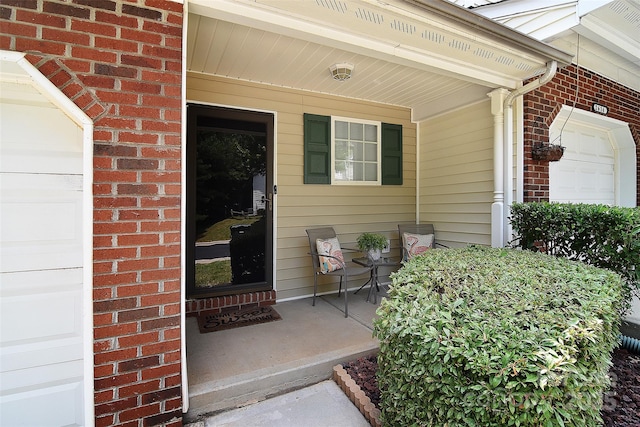 2620 Brackley Pl NW, Concord, NC 28027 - property entrance with covered porch, brick siding, and a garage