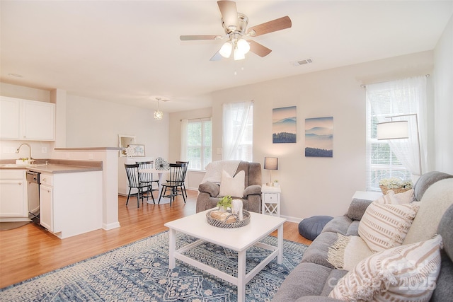 2620 Brackley Pl NW, Concord, NC 28027 - living area featuring light wood-type flooring and a ceiling fan