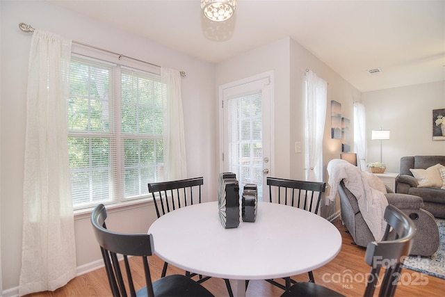 2620 Brackley Pl NW, Concord, NC 28027 - dining space with light wood-style floors and plenty of natural light