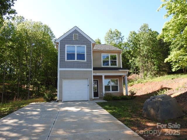 118 Carrisa Ln, Troutman, NC 28166 - view of front of house featuring concrete driveway and a garage