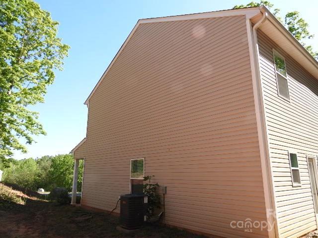 118 Carrisa Ln, Troutman, NC 28166 - view of side of home featuring a cooling unit