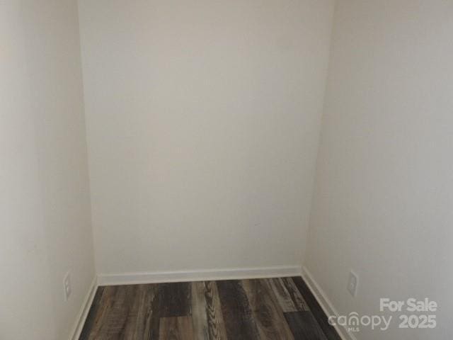 118 Carrisa Ln, Troutman, NC 28166 - empty room featuring dark wood-style floors and baseboards