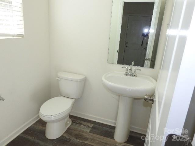 118 Carrisa Ln, Troutman, NC 28166 - half bathroom featuring toilet and wood finished floors