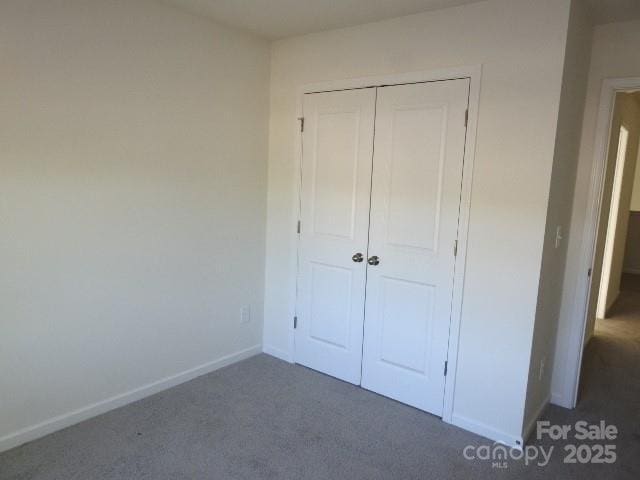 118 Carrisa Ln, Troutman, NC 28166 - unfurnished bedroom featuring carpet flooring and a closet