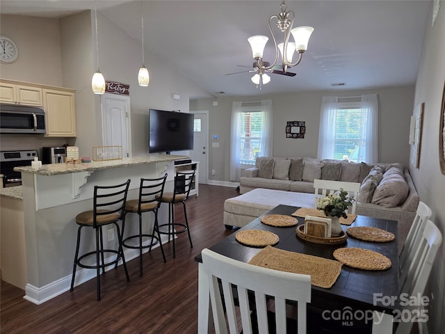 1300 Bethpage Rd, Kannapolis, NC 28081 - dining room with dark wood-type flooring, ceiling fan, high vaulted ceiling, and a chandelier