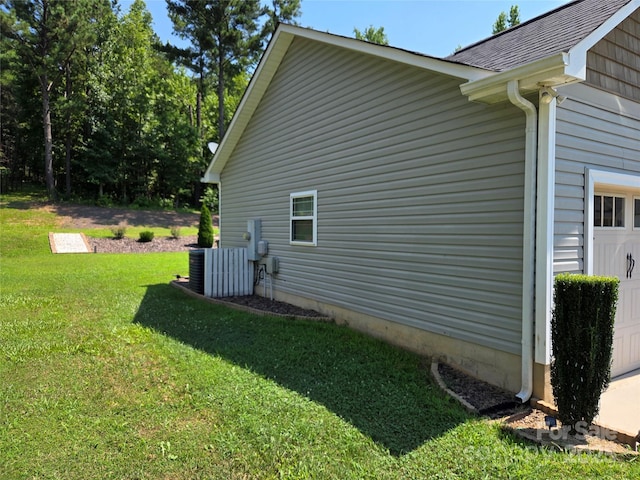 1300 Bethpage Rd, Kannapolis, NC 28081 - view of side of home with a garage, a lawn, and roof with shingles